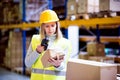 Warehouse woman worker with barcode scanner. Royalty Free Stock Photo