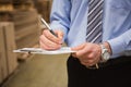 Warehouse worker checking his list on clipboard Royalty Free Stock Photo