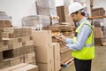 Warehouse worker checking his list on clipboard Royalty Free Stock Photo