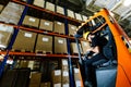 Warehouse worker doing logistics work with forklift loader Royalty Free Stock Photo