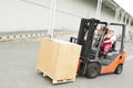 Warehouse worker driver in forklift