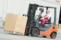 Warehouse worker driver in forklift Royalty Free Stock Photo