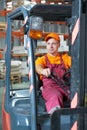 Warehouse worker driver in forklift Royalty Free Stock Photo