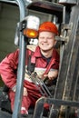 Warehouse worker driver in forklift Royalty Free Stock Photo