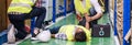 Warehouse worker frist aid after accident panoramic