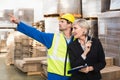 Warehouse worker and his manager working together Royalty Free Stock Photo