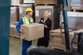 Warehouse worker and his manager working together Royalty Free Stock Photo