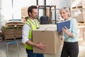 Warehouse worker and manager using tablet pc Royalty Free Stock Photo