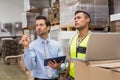 Warehouse worker and manager working together Royalty Free Stock Photo