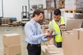 Warehouse worker and manager working together Royalty Free Stock Photo