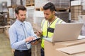 Warehouse worker and manager working together Royalty Free Stock Photo