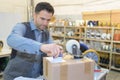 Warehouse worker preparing shipment in large warehouse Royalty Free Stock Photo