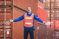 Warehouse Worker in Safety Vest Yelling in Front of Containers, Logistics Manager at Shipping Container Yard, Foreman Dock Worker Royalty Free Stock Photo