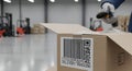 Warehouse Worker Scanning Barcode on Cardboard Box Logistics and Inventory Management in Industrial Facility Royalty Free Stock Photo