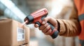 Warehouse worker scanning barcodes on boxes with a handheld scanner, showcasing Royalty Free Stock Photo