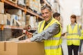 Warehouse worker sealing cardboard boxes for shipping Royalty Free Stock Photo