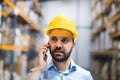 Warehouse worker or supervisor with a smartphone. Royalty Free Stock Photo