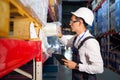 Warehouse worker takes the desired product from the shelf.