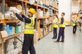 Warehouse worker taking package in the shelf Royalty Free Stock Photo