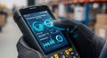 Warehouse worker uses rugged handheld device with advanced inventory management software for efficient operations Royalty Free Stock Photo