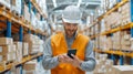 Warehouse worker using handheld device to scan barcodes for precision tracking