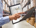 Warehouse Worker Using Tablet for Inventory Management Royalty Free Stock Photo