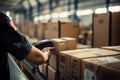 Warehouse worker using terminal to process packages in warehouse. Shallow depth of field Generative AI