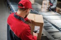 Warehouse worker working on a conveyor line