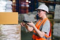 Warehouse worker working process checking the package using barcode reader in a large distribution center Royalty Free Stock Photo