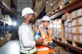 Warehouse worker working process checking the package using laptop in large warehouse distribution center Royalty Free Stock Photo