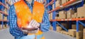 Warehouse worker working on tablets with locations