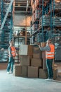 full length view of two warehouse workers working with boxes Royalty Free Stock Photo