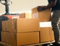 Warehouse Workers Lifting Package Boxes Stack on Pallet. Supply Chain, Shipment Boxes, Shipping Supplies Warehouse Logistic Royalty Free Stock Photo