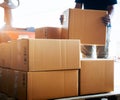 Warehouse Workers Lifting Package Boxes Stack on Pallet. Supply Chain, Shipment Boxes, Shipping Supplies Warehouse Logistic Royalty Free Stock Photo