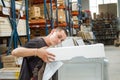 Warehouse workers pack equipment before shipment to customer