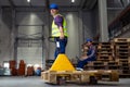 Warehouse workers pulling a pallet truck. Royalty Free Stock Photo