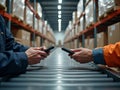 Warehouse Workers Scanning Barcodes with Handheld Devices on Conveyor Belt for Logistics Royalty Free Stock Photo