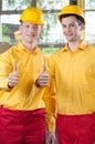 Warehouse workers showing thumbs up sign Royalty Free Stock Photo