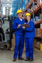 Warehouse workers standing together in warehouse Royalty Free Stock Photo