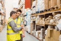 Warehouse workers talking together at work Royalty Free Stock Photo