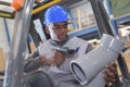 Warehouseman with protective vest and scanner