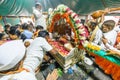 Warkari and other people taking darshan of the paduka of saint Dnyaneshawar that are kept in the palkhi