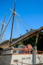 Old fashioned sailing boats moored alongside waterfront pier on Mahurangi River Royalty Free Stock Photo