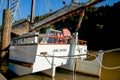 Old fashioned sailing boats moored alongside waterfront pier on Mahurangi River Royalty Free Stock Photo
