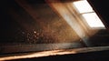 Warm attic interior with sunbeam illuminating dust motes Royalty Free Stock Photo