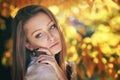 Warm autumn portrait of a young woman