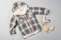 Warm baby coat for boys on gray background top view