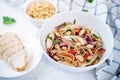 Warm backwheat pasta chicken vegetables salad with peanuts Royalty Free Stock Photo