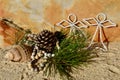 Warm Beach Christmas pine cone white beaded angels beach sand and shell Christmas in July Royalty Free Stock Photo