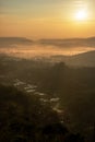 Warm beautiful foggy village with yellow light Royalty Free Stock Photo